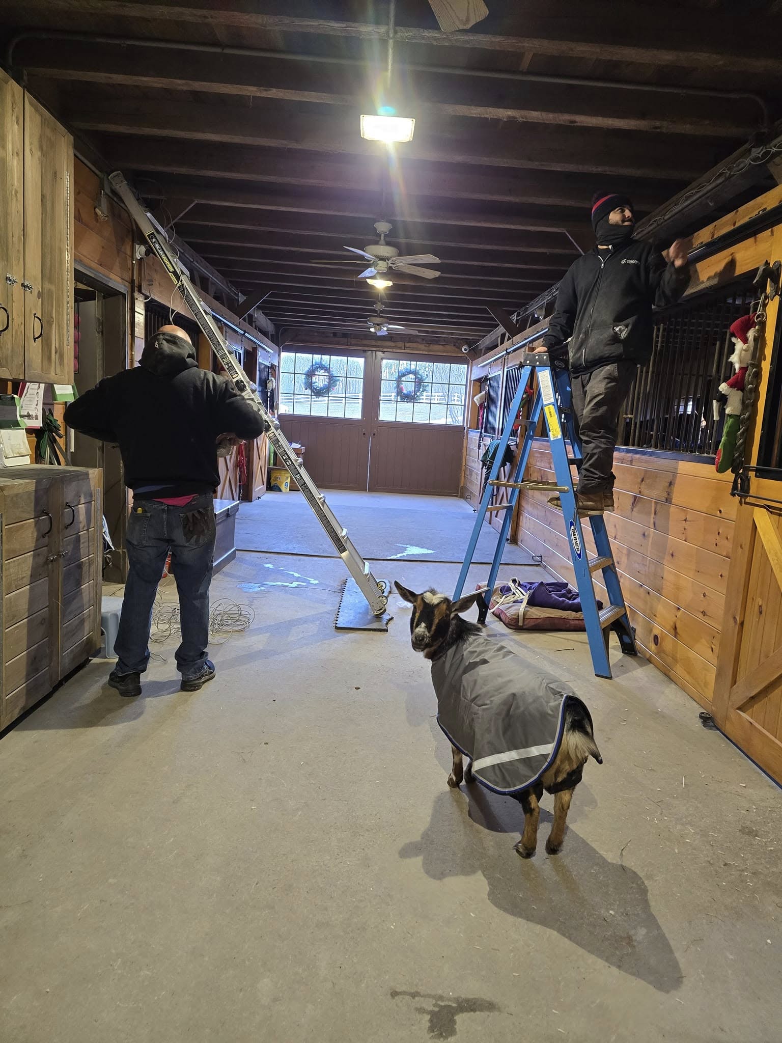 Professional workshop setup with technicians installing security cameras